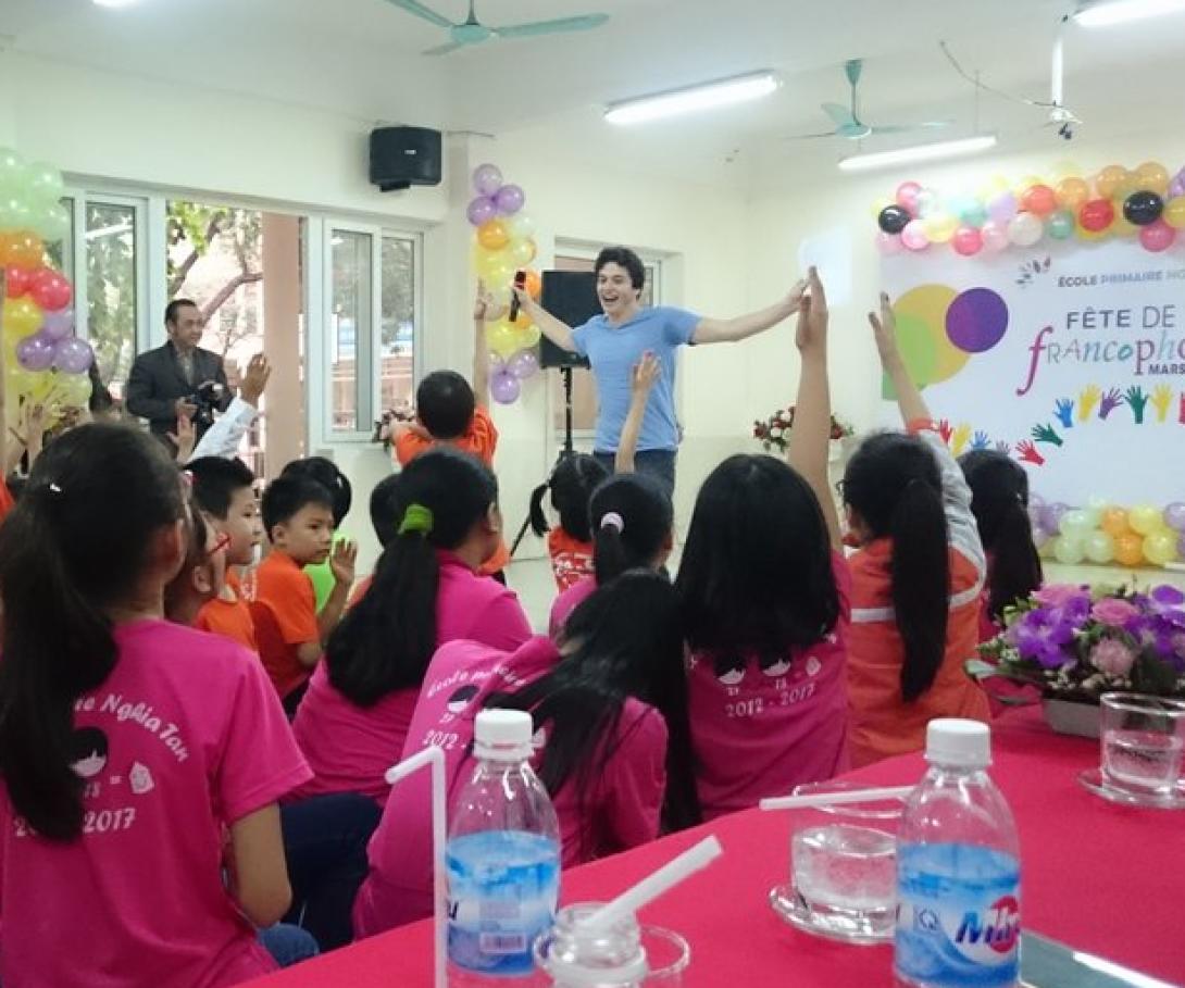 A student from Westpoint University gives a presentation to children in Vietnam during his group volunteer trip. A student from Westpoint University gives a presentation to children in Vietnam during his group volunteer trip.
